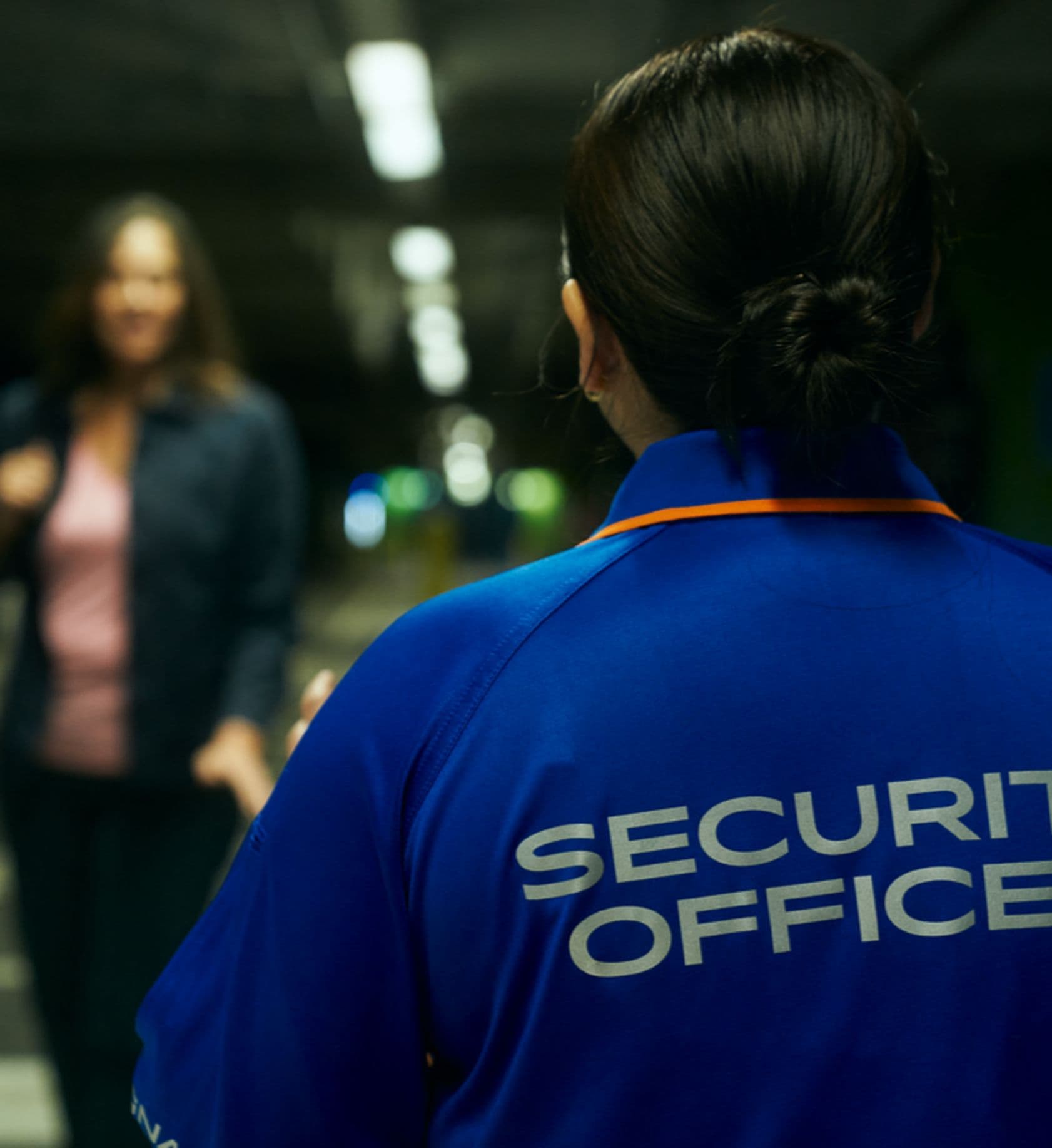 view of security officer form behind