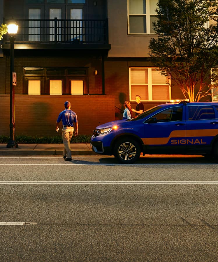 Signal employee walking in front of company vehicle