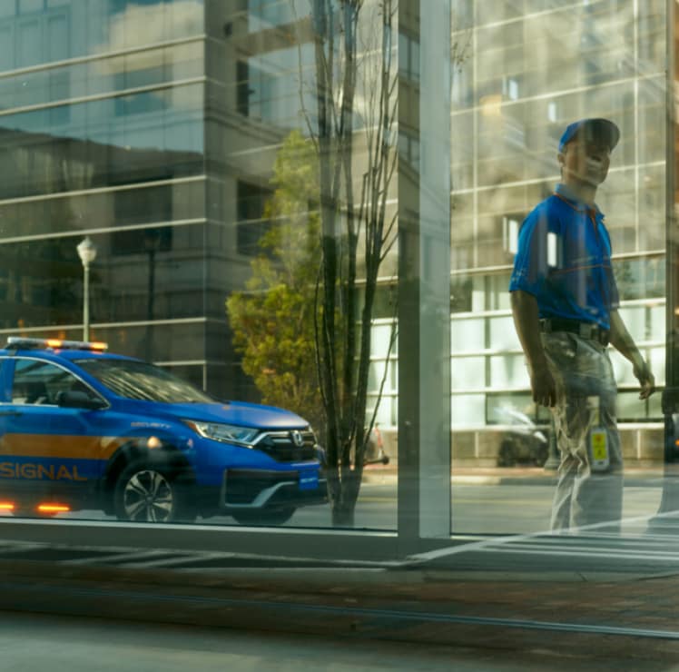 reflection of Signal employee in window